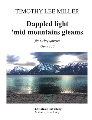 Dappled light 'mid mountains gleams